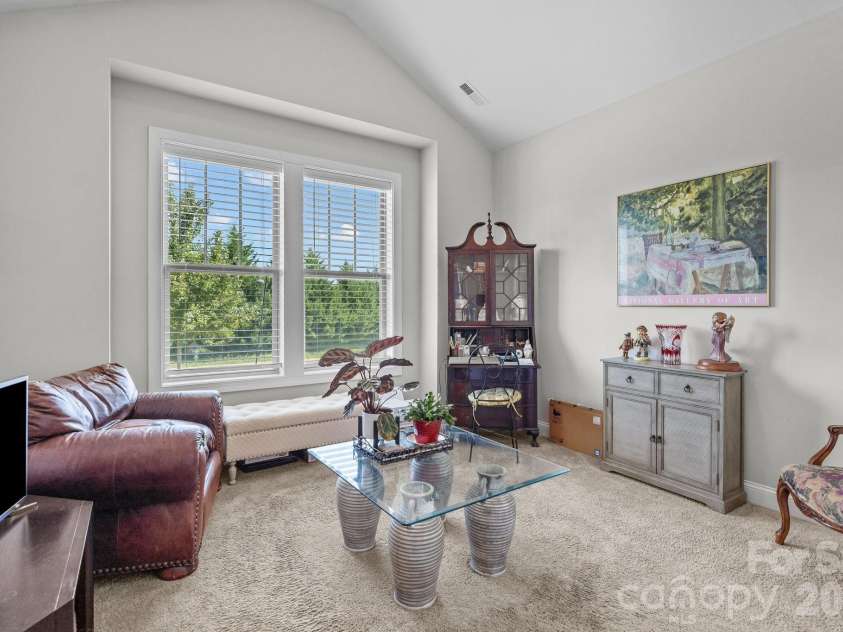4697 Rinaldo Road, York, SC 29745.  MLS# CAR4380475, YatesRealty ID 26392. Front bedroom with large windows and vaulted ceiling