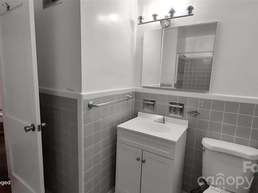 1662 Browns Avenue, Charlotte, NC 28208.  MLS# CAR4385030, YatesRealty ID 26393. Hall Bathroom