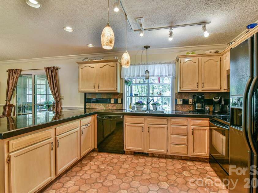 145 Fox Glen Drive, Arden, NC 28704.  MLS# CAR4134713, YatesRealty ID 26394. Kitchen with tile flooring