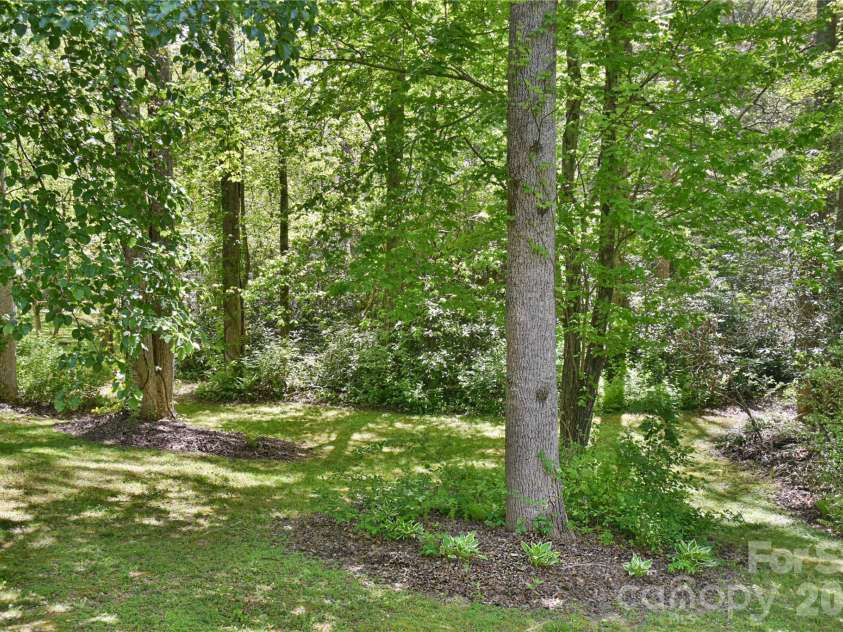 145 Fox Glen Drive, Arden, NC 28704.  MLS# CAR4134713, YatesRealty ID 26394. Nicely landscaped side yard