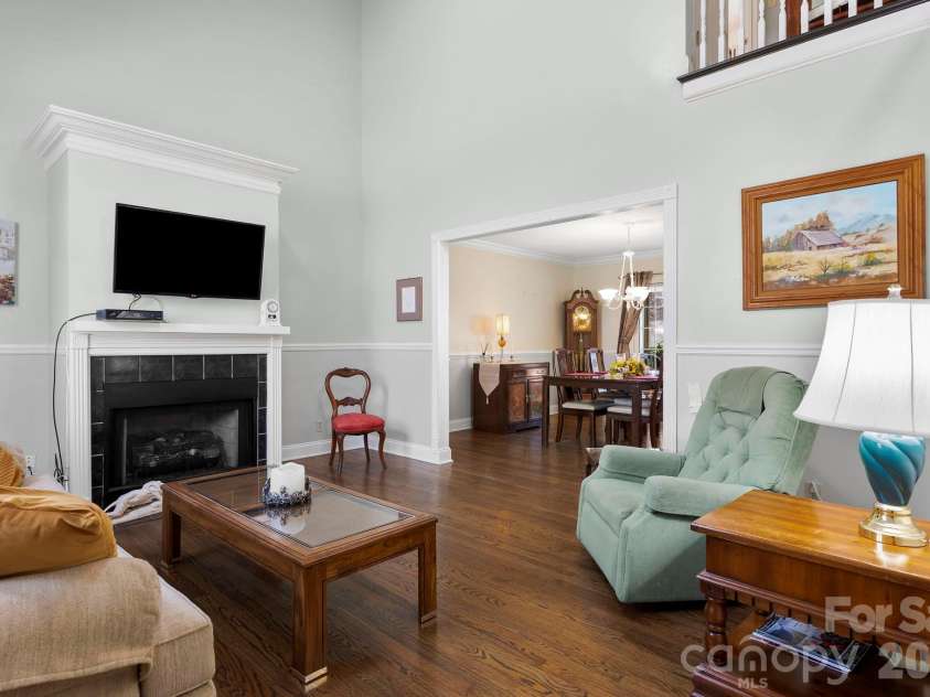 145 Fox Glen Drive, Arden, NC 28704.  MLS# CAR4134713, YatesRealty ID 26394. Spacious living room opens into dining room