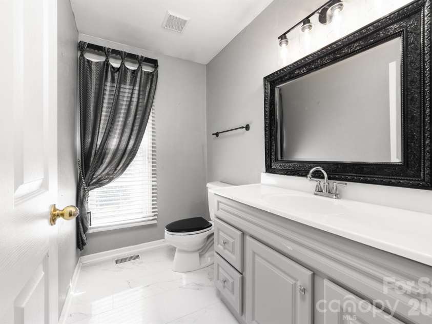 20127 Chapel Point Lane, Cornelius, NC 28031.  MLS# CAR4423446, YatesRealty ID 26399. Guest Half Bath