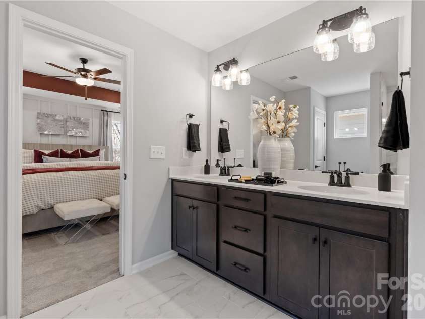 5081 Puddle Pond Road, Indian Trail, NC 28079.  MLS# CAR4386874, YatesRealty ID 26405. Representational photo *Model home*Primary bath
