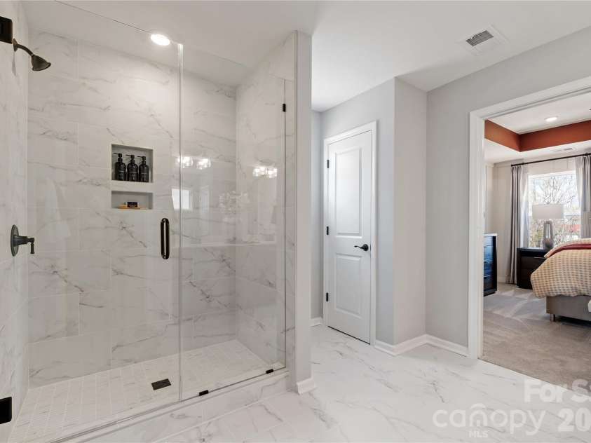 5081 Puddle Pond Road, Indian Trail, NC 28079.  MLS# CAR4386874, YatesRealty ID 26405. Representational photo *Model home*Primary bath