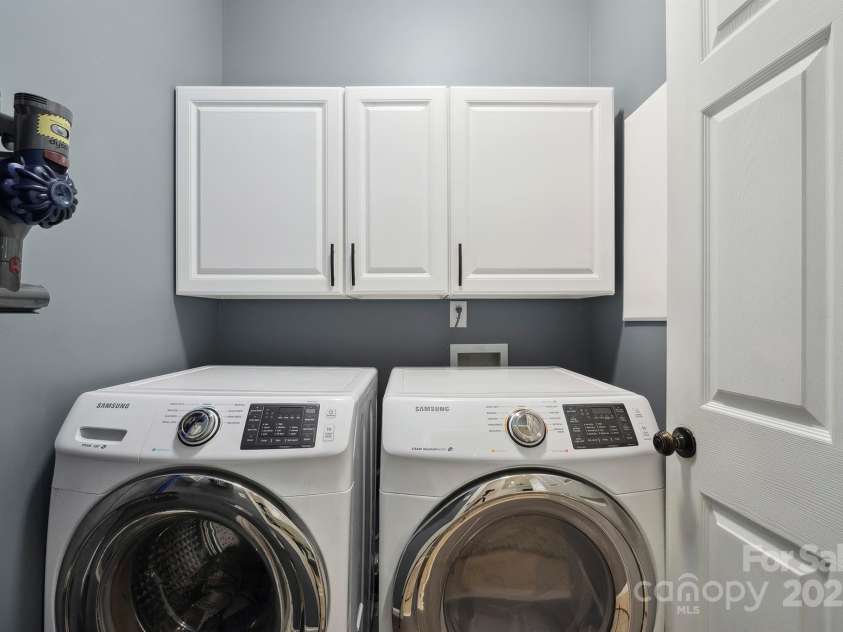 7025 Sedgebrook Drive, Stanley, NC 28164.  MLS# CAR4276849, YatesRealty ID 26407. Laundry Room with Upper Cabinets.