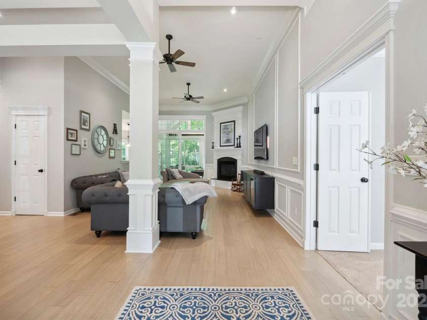 7025 Sedgebrook Drive, Stanley, NC 28164.  MLS# CAR4276849, YatesRealty ID 26407. Spacious Foyer with Wainscoting and Designer Chandelier.