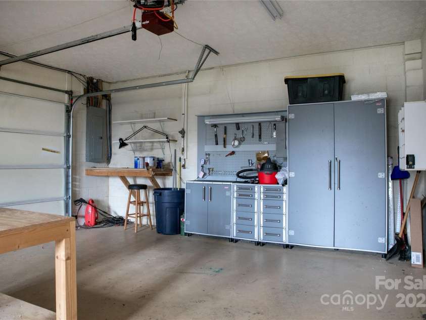 42 Tsitsi Court, Brevard, NC 28712.  MLS# CAR4326496, YatesRealty ID 2641. 2 car garage with work bench