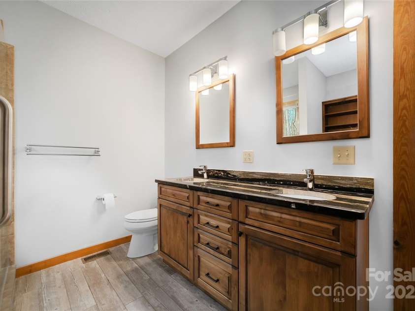 42 Tsitsi Court, Brevard, NC 28712.  MLS# CAR4326496, YatesRealty ID 2641. Primary Bathroom with custom cabinets and heated floor