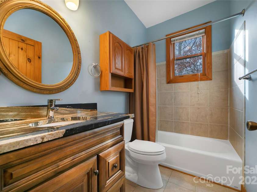 42 Tsitsi Court, Brevard, NC 28712.  MLS# CAR4326496, YatesRealty ID 2641. Secondary bathroom with custom cabinets