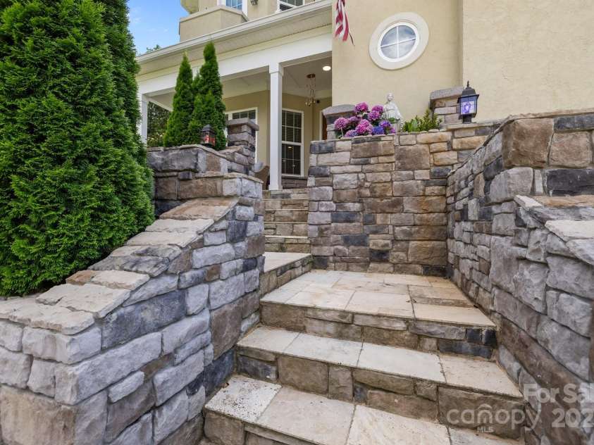 2117 Middlebridge Court, Fort Mill, SC 29715.  MLS# CAR4270419, YatesRealty ID 2642. Detailed stone staircase entry.