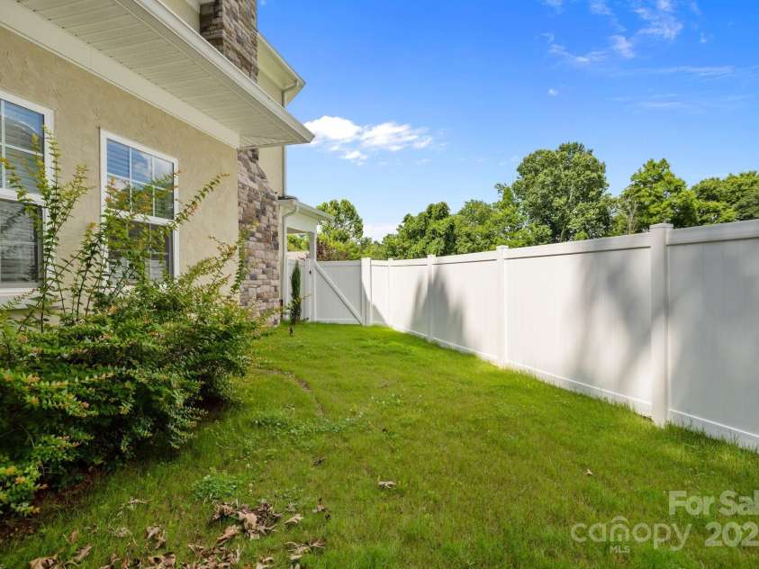 2117 Middlebridge Court, Fort Mill, SC 29715.  MLS# CAR4270419, YatesRealty ID 2642. Left side yard area
