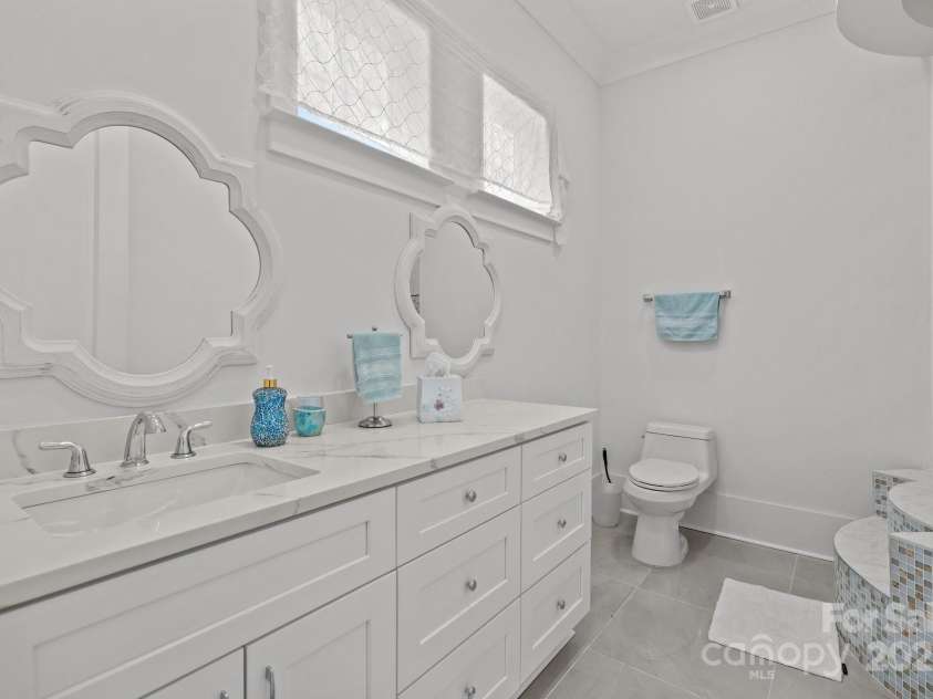 2117 Middlebridge Court, Fort Mill, SC 29715.  MLS# CAR4270419, YatesRealty ID 2642. Main level full bathroom services BR 1