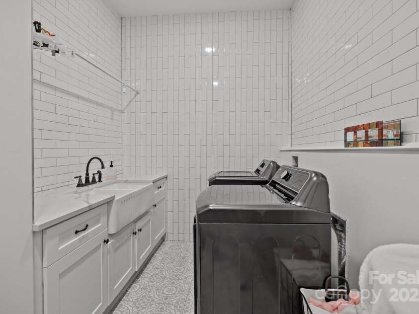 2117 Middlebridge Court, Fort Mill, SC 29715.  MLS# CAR4270419, YatesRealty ID 2642. Rear laundry room at main level