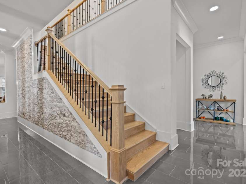 2117 Middlebridge Court, Fort Mill, SC 29715.  MLS# CAR4270419, YatesRealty ID 2642. White oak staircase, stack stone accents
