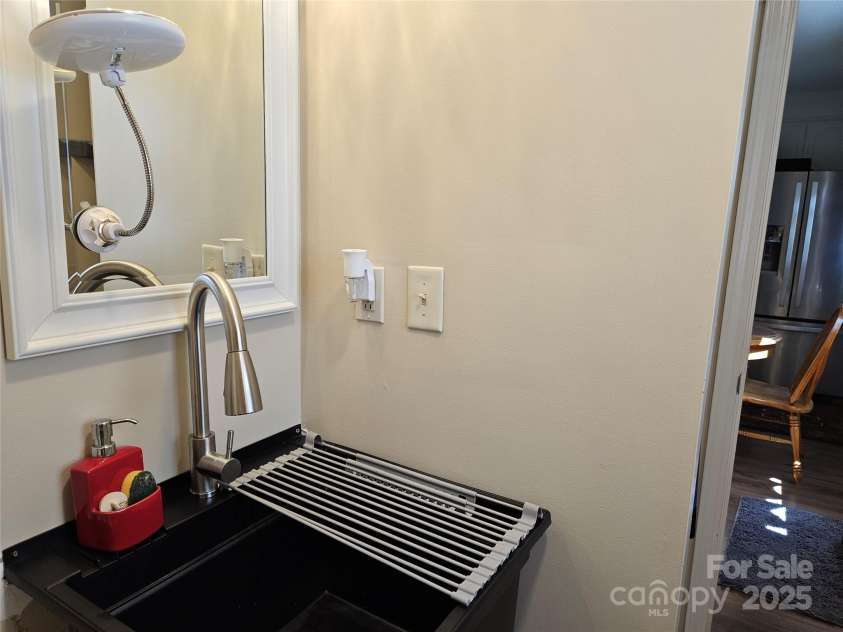 818 Laurel Street, Lincolnton, NC 28092.  MLS# CAR4282126, YatesRealty ID 26424. Bathroom w utility sink
