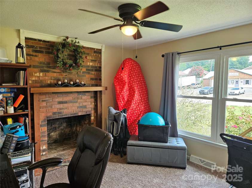 818 Laurel Street, Lincolnton, NC 28092.  MLS# CAR4282126, YatesRealty ID 26424. Bedroom 3 w fireplace