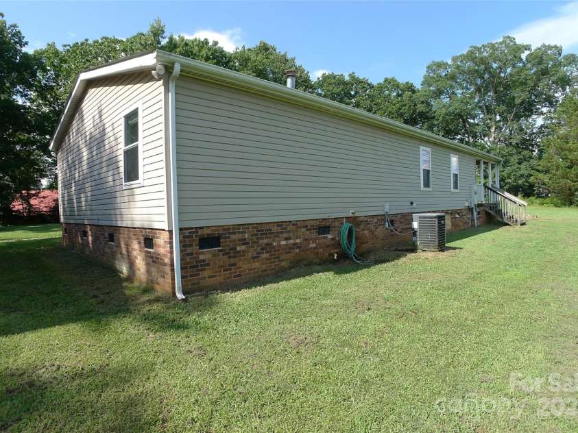 145 Abigail Trail, Ararat, NC 27007.  MLS# CAR4282506, YatesRealty ID 26432. Back right of house
