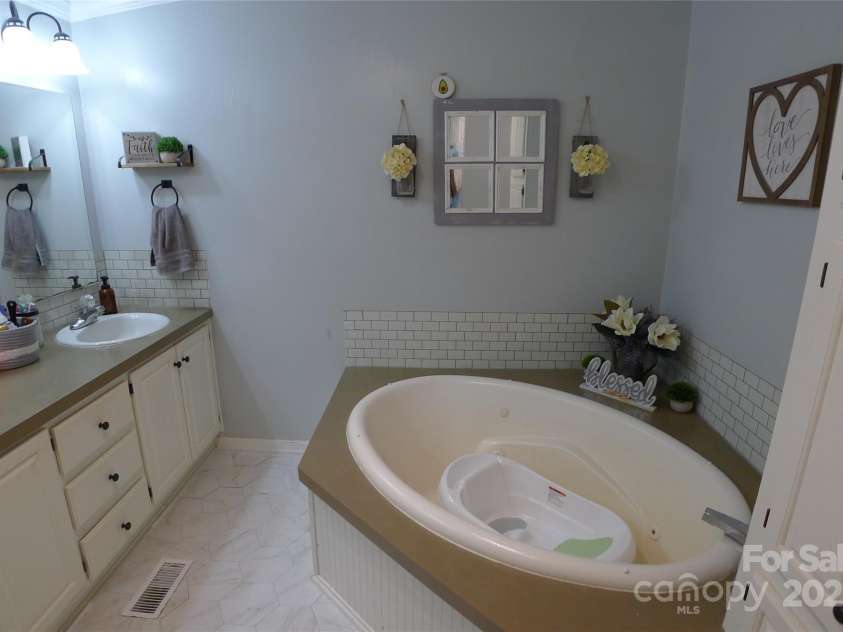145 Abigail Trail, Ararat, NC 27007.  MLS# CAR4282506, YatesRealty ID 26432. Primary bathroom