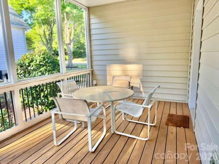 20131 Tailwind Lane, Cornelius, NC 28031.  MLS# CAR4381128, YatesRealty ID 26441. Connecting side porch for outside dining