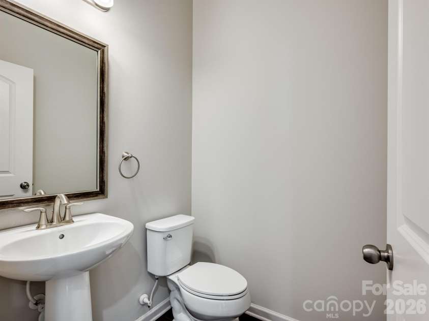 1112 Doveridge Street, Charlotte, NC 28273.  MLS# CAR4358560, YatesRealty ID 26444. Half bath on upper/2nd floor off the kitchen.