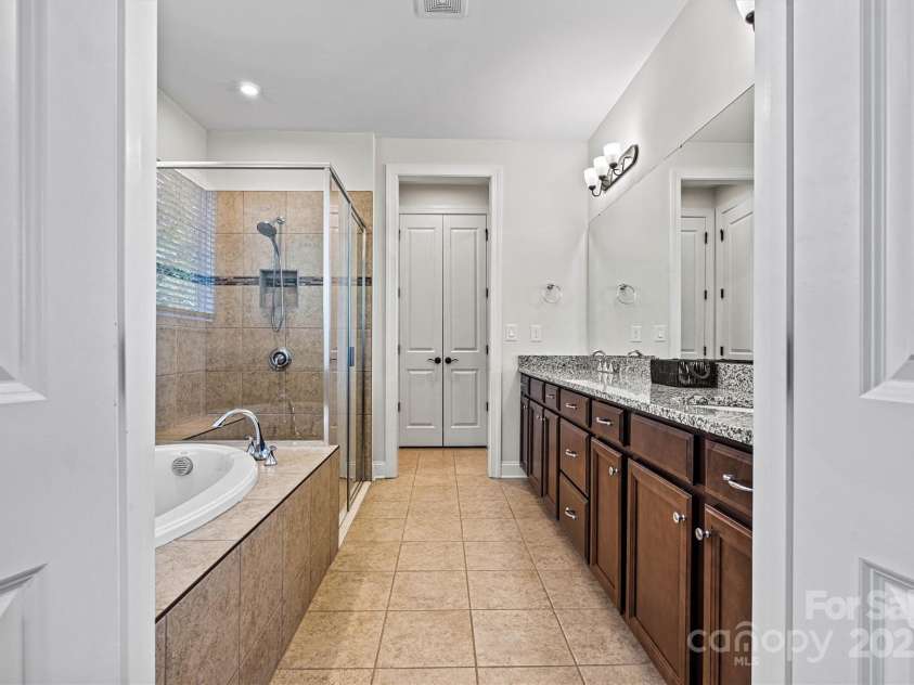 4128 Honey Locust Drive, Charlotte, NC 28215.  MLS# CAR4280913, YatesRealty ID 26446. A generously sized secondary / Guest bedroom offers flexibility for guests, home office, or hobby space.