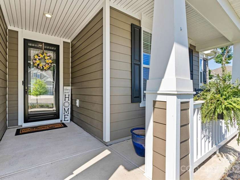4128 Honey Locust Drive, Charlotte, NC 28215.  MLS# CAR4280913, YatesRealty ID 26446. A welcoming front porch - perfect for rocking chairs - and beautiful glass entry door (with storm door!) greet you—setting the tone for comfort and style throughout.