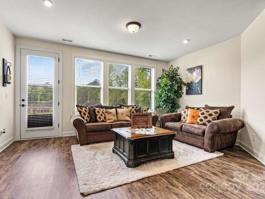 4128 Honey Locust Drive, Charlotte, NC 28215.  MLS# CAR4280913, YatesRealty ID 26446. Retreat to your spacious primary suite with tray ceiling and soft natural light—your own private escape.