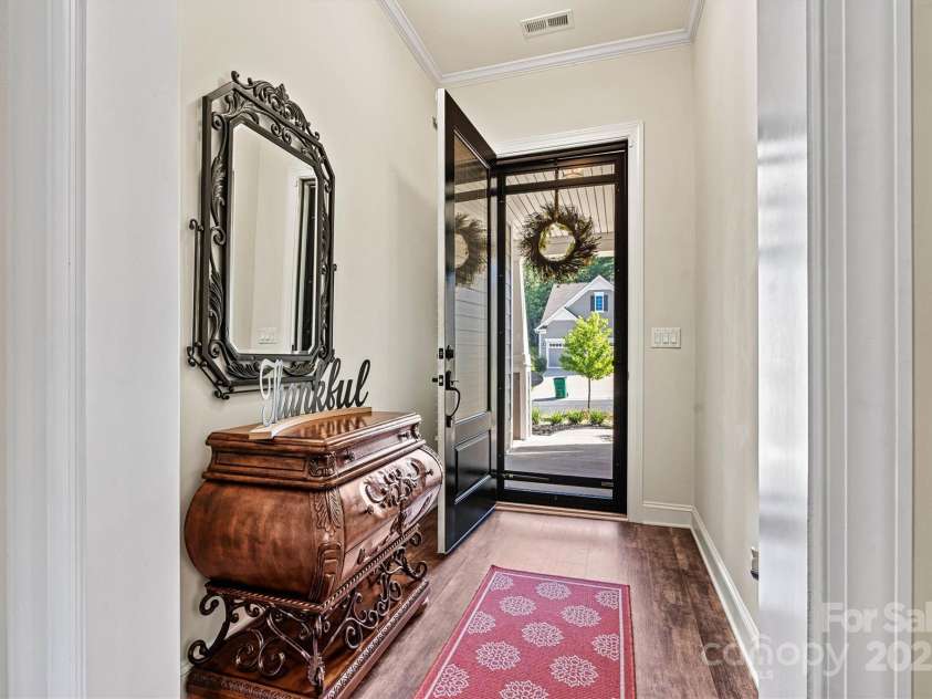 4128 Honey Locust Drive, Charlotte, NC 28215.  MLS# CAR4280913, YatesRealty ID 26446. Step inside to a bright and airy foyer—where natural light and a thoughtful layout welcome you home.