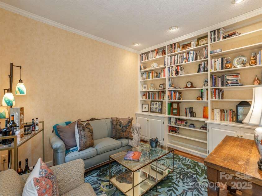 4 Silverstone Drive, Asheville, NC 28805.  MLS# CAR4280244, YatesRealty ID 26447. Living Room with Book Cases