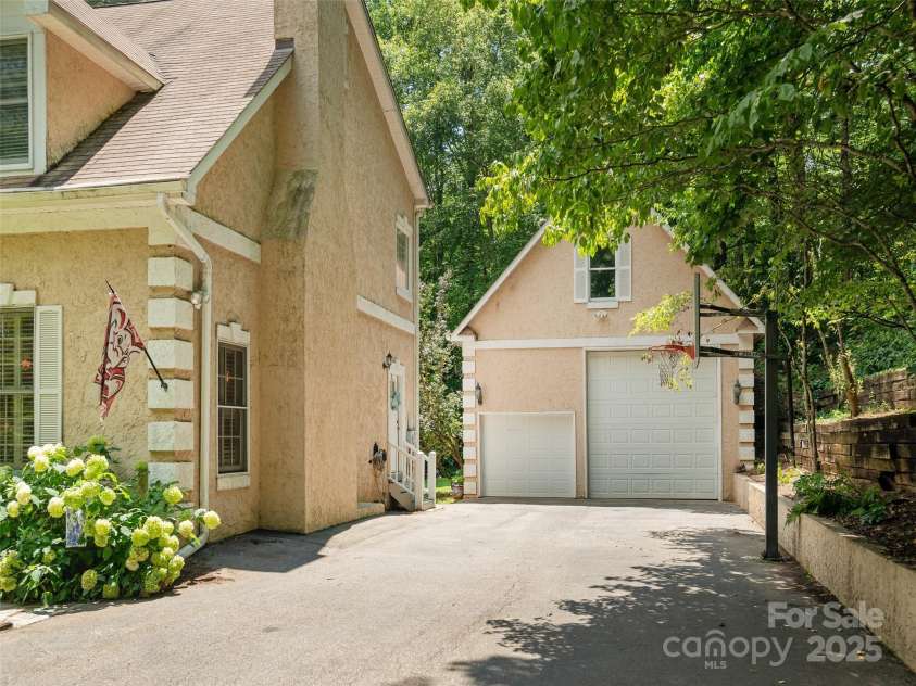 4 Silverstone Drive, Asheville, NC 28805.  MLS# CAR4280244, YatesRealty ID 26447. Oversized Garage Door for your Camper