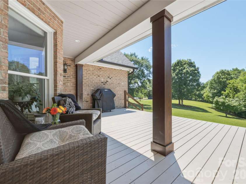 6355 Hickory Hill Lane, Stanfield, NC 28163.  MLS# CAR4381916, YatesRealty ID 26447. Covered back deck overlooking private acreage