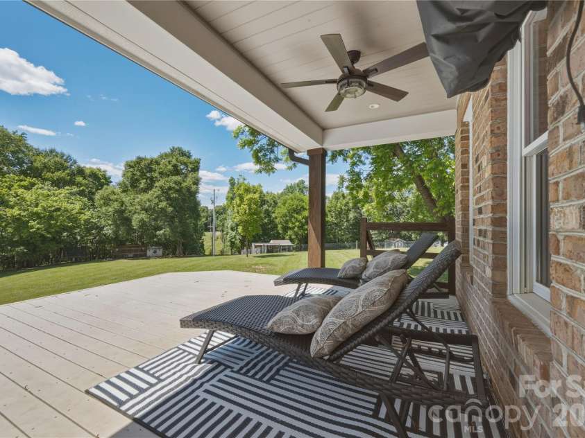 6355 Hickory Hill Lane, Stanfield, NC 28163.  MLS# CAR4381916, YatesRealty ID 26447. Covered back deck with ceiling fan 