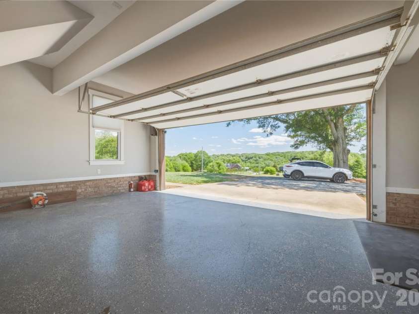 6355 Hickory Hill Lane, Stanfield, NC 28163.  MLS# CAR4381916, YatesRealty ID 26447. Epoxy flooring in garage with interior door access
