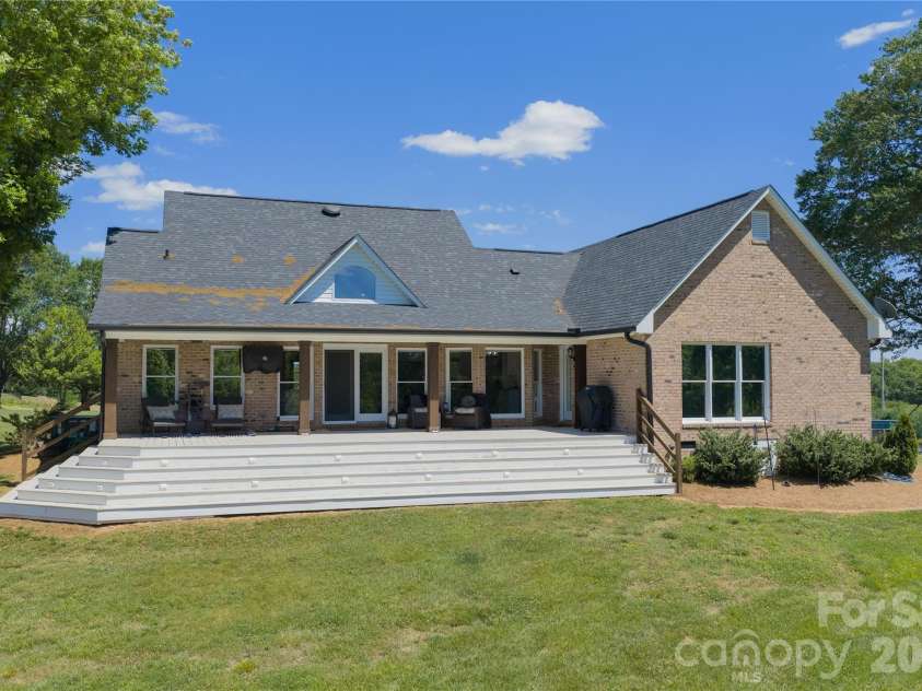 6355 Hickory Hill Lane, Stanfield, NC 28163.  MLS# CAR4381916, YatesRealty ID 26447. Large covered back deck overlooking private acreage