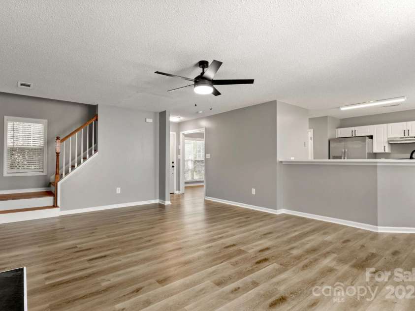 7621 Rolling Meadows Lane, Huntersville, NC 28078.  MLS# CAR4282500, YatesRealty ID 26448. BACK STAIRCASE TO UPPER LEVEL