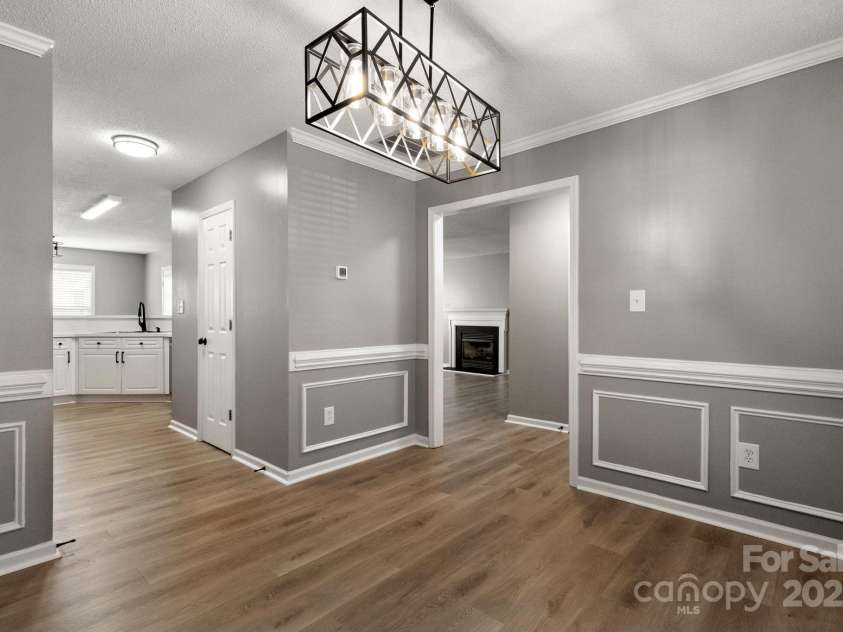 7621 Rolling Meadows Lane, Huntersville, NC 28078.  MLS# CAR4282500, YatesRealty ID 26448. DINING ROOM OPENS TO KITCHEN AND FOYER
