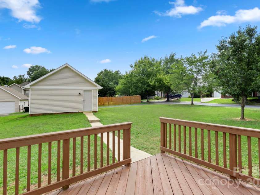 7621 Rolling Meadows Lane, Huntersville, NC 28078.  MLS# CAR4282500, YatesRealty ID 26448. THIS AMAZING DECK AND THE VIEW OF THE AMAZING YARD.