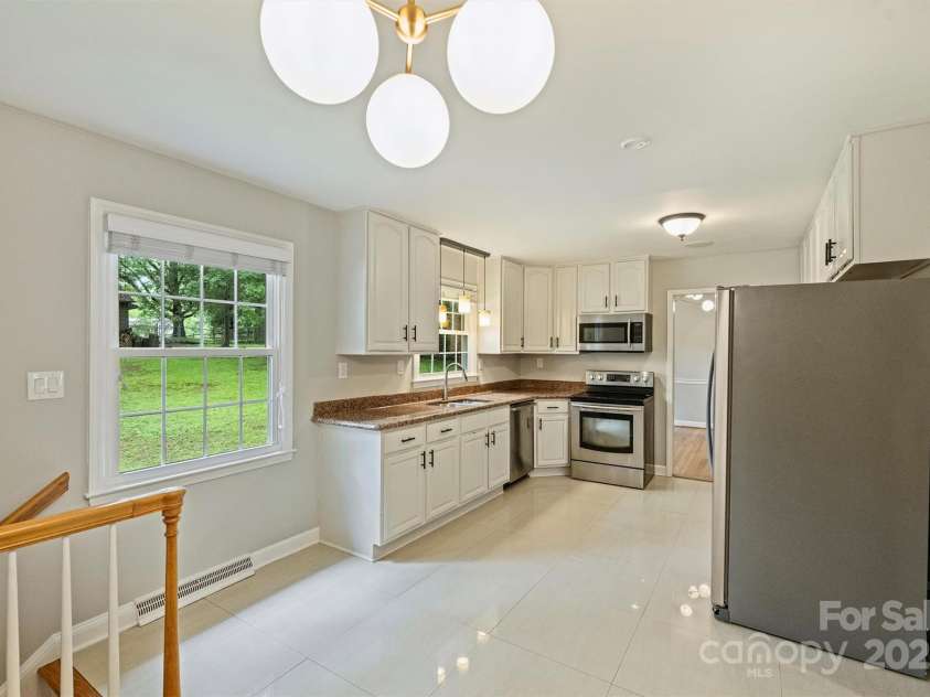 2301 Seth Thomas Road, Charlotte, NC 28210.  MLS# CAR4265395, YatesRealty ID 26452. Kitchen on Main level overlooking backyard