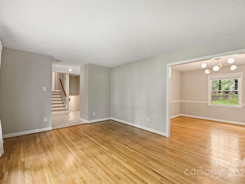 2301 Seth Thomas Road, Charlotte, NC 28210.  MLS# CAR4265395, YatesRealty ID 26452. Living Room open to Dining Room