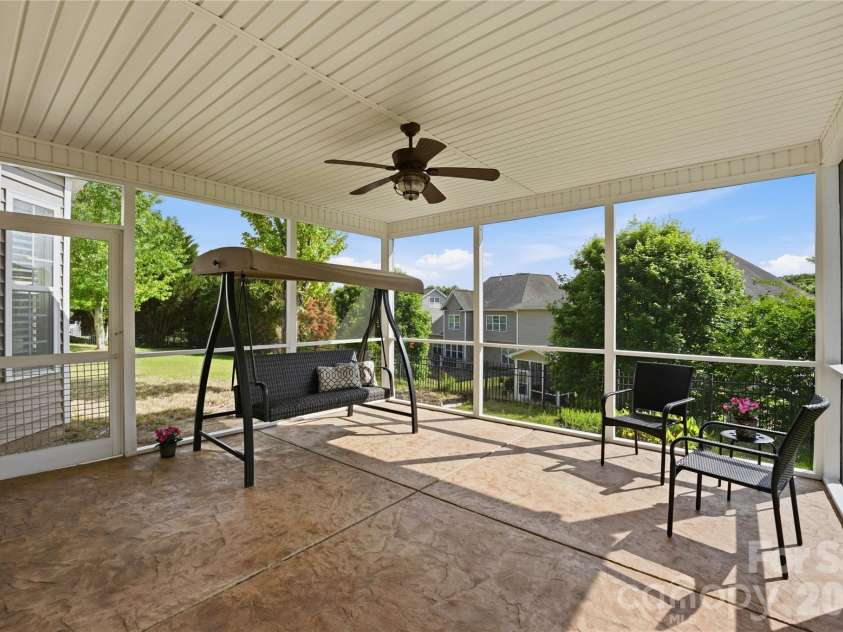 5068 Gladiola Way, Tega Cay, SC 29708.  MLS# CAR4371623, YatesRealty ID 26455. Covered screened back porch
