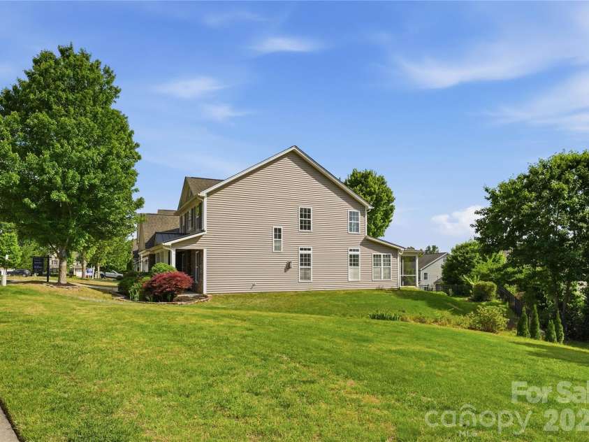 5068 Gladiola Way, Tega Cay, SC 29708.  MLS# CAR4371623, YatesRealty ID 26455. Empty Green space next to the home to give more privacy