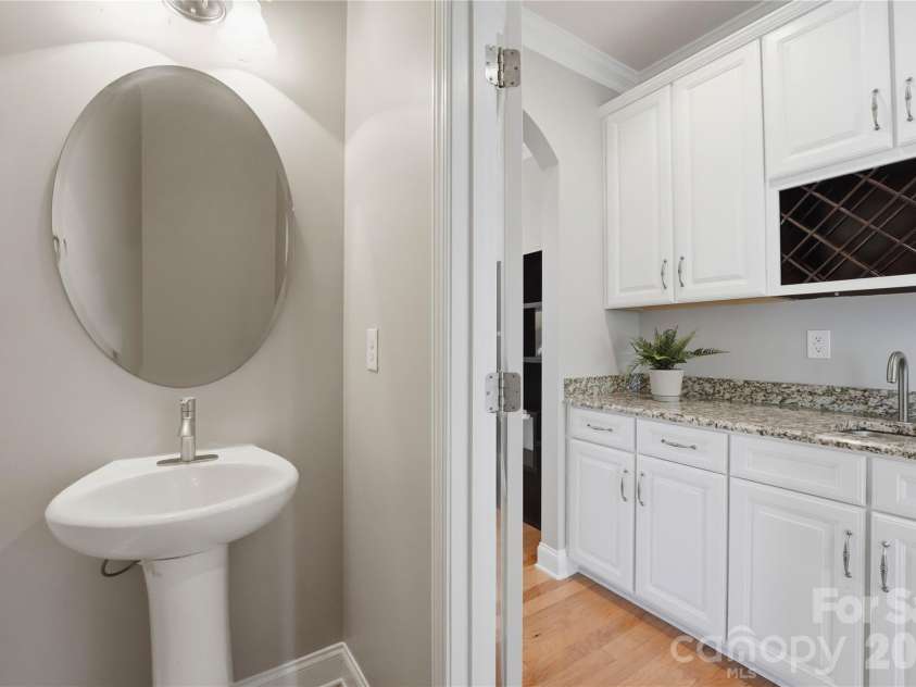 5068 Gladiola Way, Tega Cay, SC 29708.  MLS# CAR4371623, YatesRealty ID 26455. Powder room on main floor