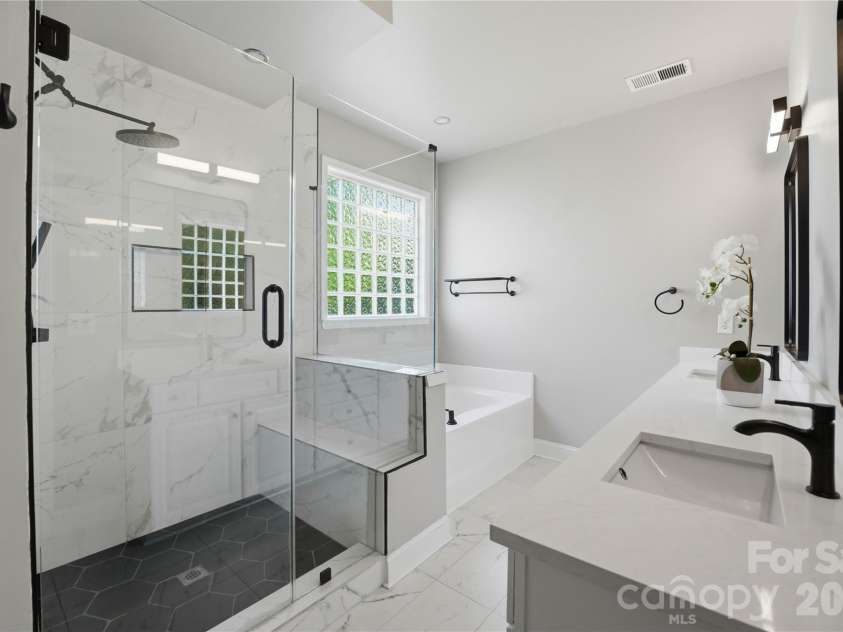 5068 Gladiola Way, Tega Cay, SC 29708.  MLS# CAR4371623, YatesRealty ID 26455. Primary updated bathroom