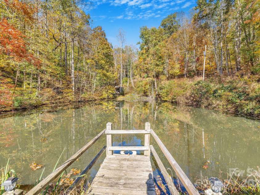226 Fish Pond Lane, Burnsville, NC 28714.  MLS# CAR4326469, YatesRealty ID 2646. Enjoy fishing in the stocked pond.