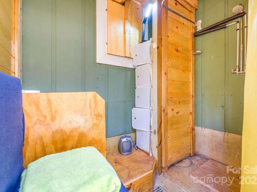 226 Fish Pond Lane, Burnsville, NC 28714.  MLS# CAR4326469, YatesRealty ID 2646. Interior of outdoor shower.