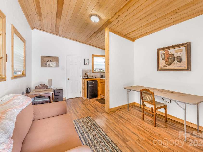 226 Fish Pond Lane, Burnsville, NC 28714.  MLS# CAR4326469, YatesRealty ID 2646. Interior of studio/cabin space.