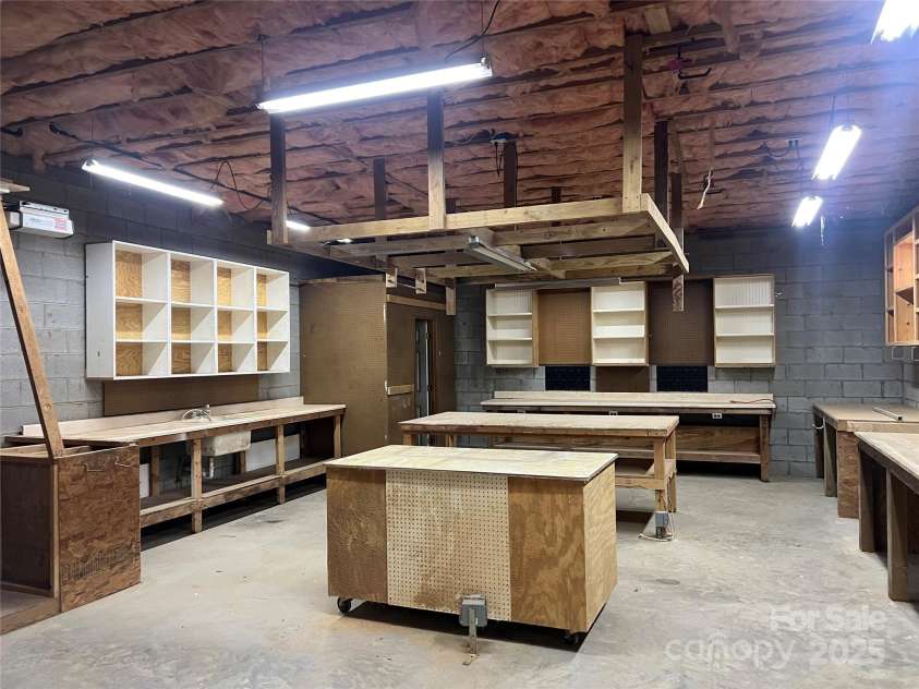 92 Winston Avenue, Asheville, NC 28803.  MLS# CAR4277566, YatesRealty ID 26461. Workshop with a half bath- main floor of 2nd structure