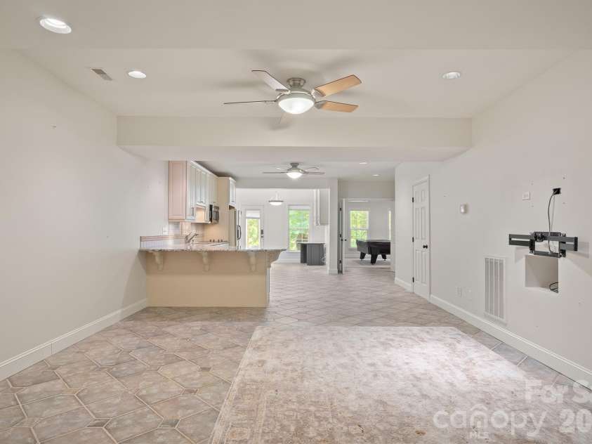 14509 Greenpoint Lane, Huntersville, NC 28078.  MLS# CAR4380000, YatesRealty ID 26472. Basement with kitchen
