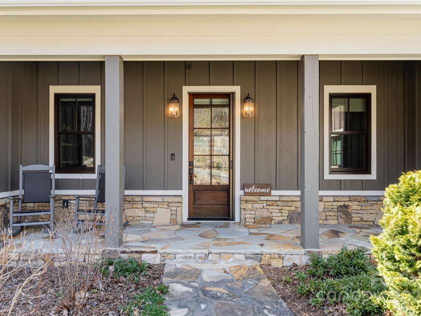 28 Woodland Aster Way, Asheville, NC 28804.  MLS# CAR4212425, YatesRealty ID 26479. Covered front porch with stone accents