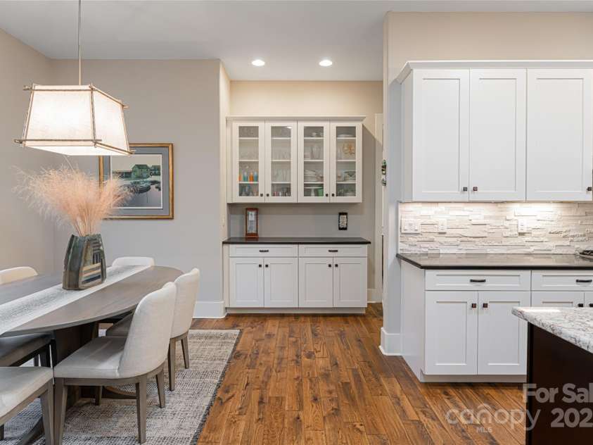 28 Woodland Aster Way, Asheville, NC 28804.  MLS# CAR4212425, YatesRealty ID 26479. Custom cabinetry accents the kitchen/dining area
